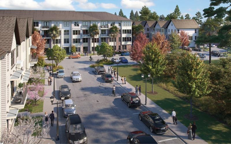 a street with cars and people on it and buildings around it